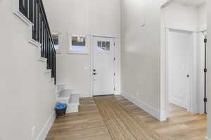 Entrance foyer featuring light hardwood / wood-style flooring