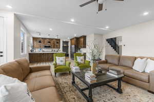 Living room featuring ceiling fan