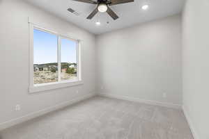 Carpeted bedroom room with ceiling fan