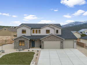 View of front of home featuring a mountain view