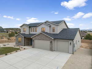 View of front of home with a 3 car garage