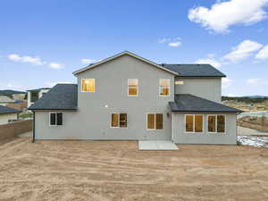 Rear view of house featuring a patio