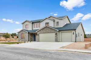 View of front of house featuring a 3-car garage