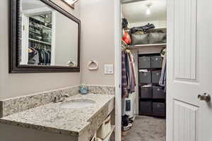 Sink only with vanity and a textured ceiling