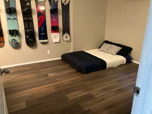 Bedroom featuring dark hardwood / wood-style flooring