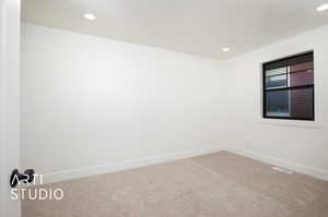 Bedroom #2 w/NEW Carpet, NEW Window & Built-In Shelves In Oversized Closet.