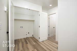 Laundry Room Featuring Gas & Electric Dryer Hookups, Washer Hookups, Shelving & French Doors For Easy Access.