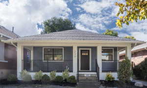 Bungalow-style Home Featuring NEW Covered Trex Porch & Black Railing