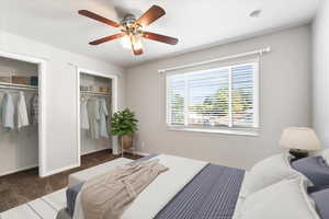 Primary Bedroom: ceiling fan and dark carpet