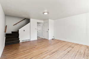 Living room: light hardwood / wood-style floors