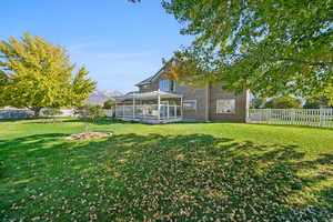 View of yard with a mountain view and a sunroom