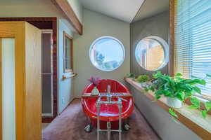 Bathroom with a tub and vaulted ceiling