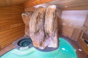 View of sauna with wooden walls and wooden ceiling