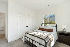 Bedroom with carpet floors and a closet