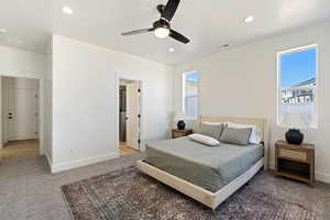 Carpeted bedroom with ceiling fan