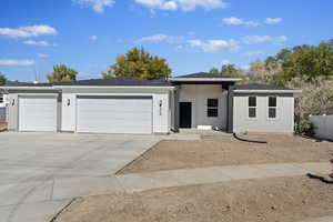 View of front of home featuring a garage