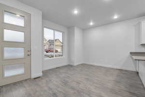 Entrance foyer with light wood-type flooring