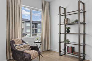 Living area with light hardwood / wood-style flooring