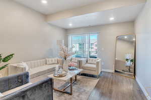 Living room with wood-type flooring