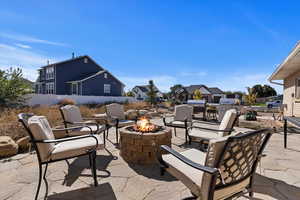 View of patio / terrace featuring an outdoor fire pit