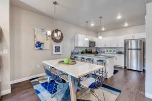 Dining room featuring dark hardwood / wood-style floors and sink