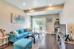 Living room featuring dark hardwood / wood-style flooring