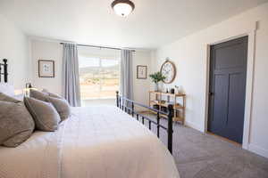 Carpeted bedroom featuring a mountain view