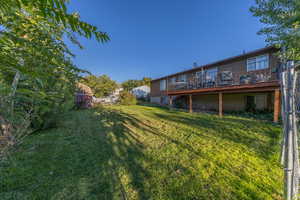 View of yard featuring a wooden deck