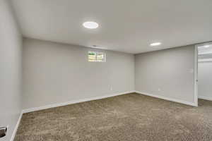 Basement featuring carpet flooring