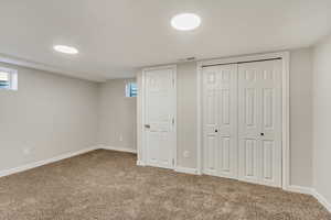 Unfurnished bedroom with carpet floors