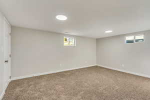 Basement with carpet flooring