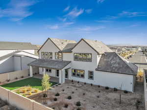 Rear view of property with a patio area