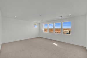 View of carpeted spare room