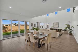 Dining space featuring plenty of natural light and light hardwood / wood-style floors