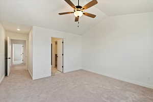 Interior space featuring ceiling fan and lofted ceiling