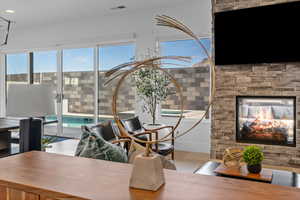 Office space featuring a stone fireplace