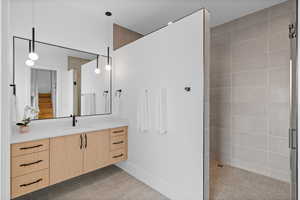 Bathroom featuring vanity and walk in shower