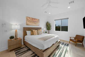 Bedroom featuring light tile patterned floors and ceiling fan