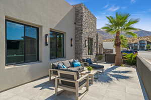 View of patio / terrace with an outdoor hangout area and a mountain view