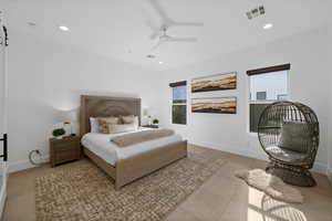 Tiled bedroom with ceiling fan