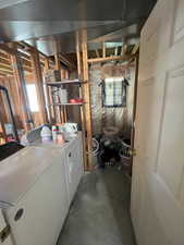 Clothes washing area featuring washer and clothes dryer