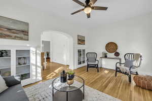 Unit 1415: Features original built-ins, arched doorway, and hardwood floors