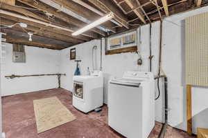 Unit 1417 Large Laundry room in basement with ample storage space