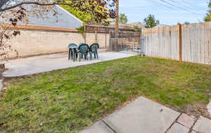 Unit 1415. Private backyard with cement pad and alley behind. Great for entertaining, parking, RV storage, etc.