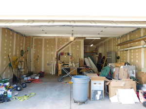 Oversized 738 sq ft 3 - car garage, 220 V Power, and Hot/Cold Water.