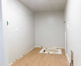 Laundry Room with Crawl Space Access.