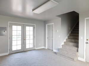 View of French Doors to Backyard. The other door is a future unfinished bedroom.