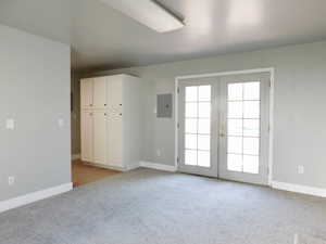 Family Room with French Doors Leading Outside to the Trex Deck and Yard.