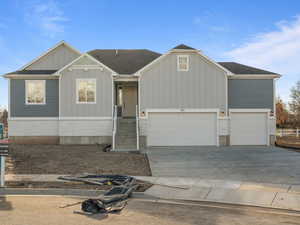 View of front facade featuring a garage