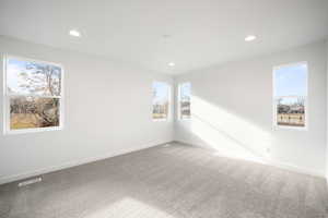 Primary Bedroom featuring carpet